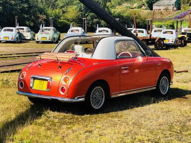 Foxy orange Nissan Figaro exterior