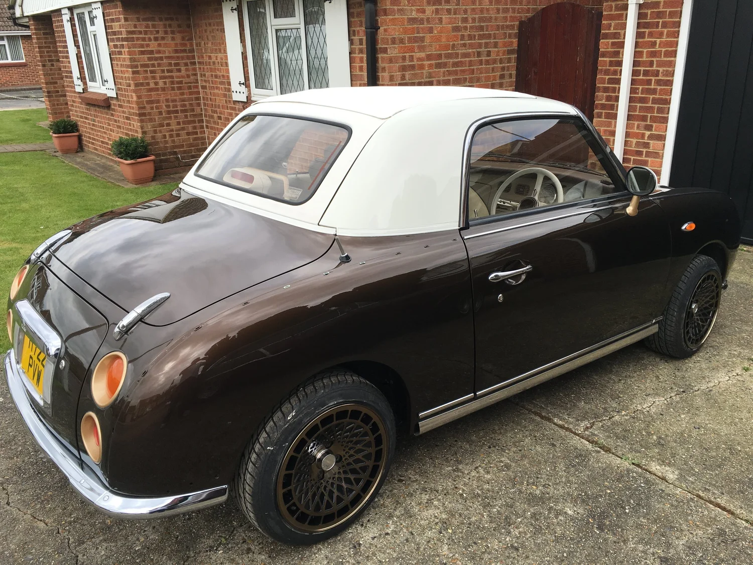 Bronze Beauty Nissan Figaro exterior