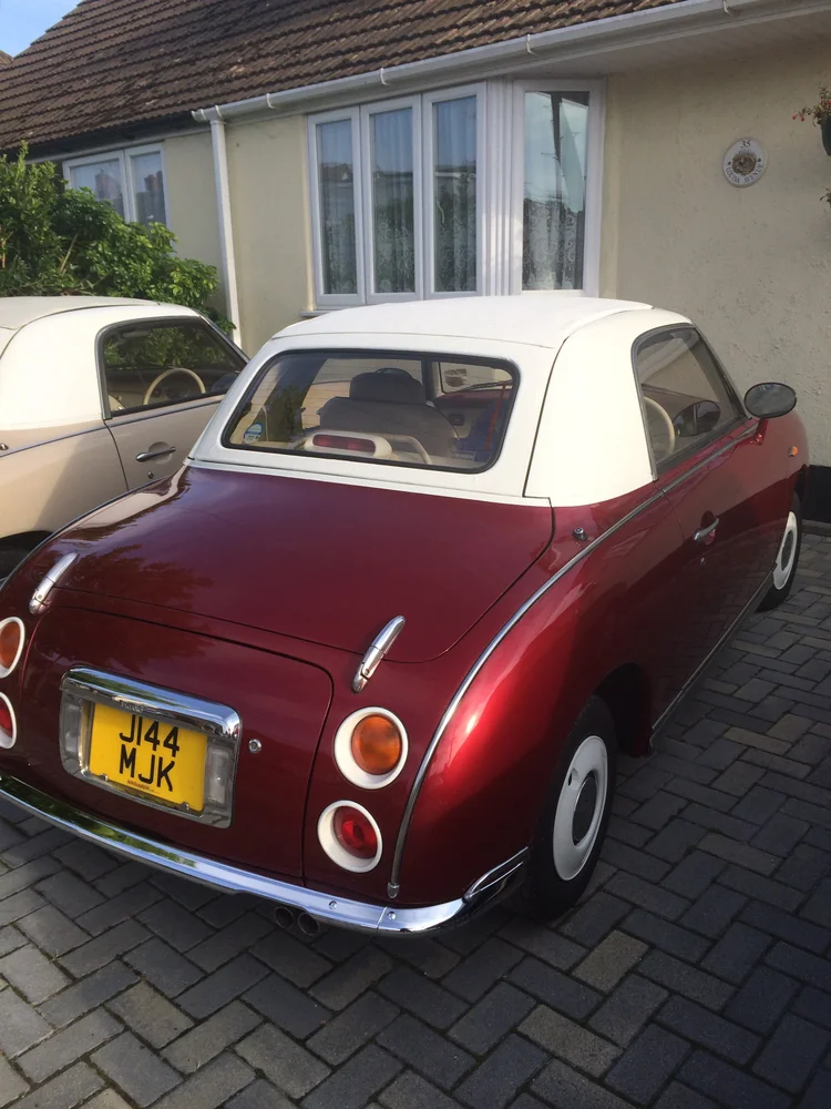 Mr D’Arcy red Nissan Figaro